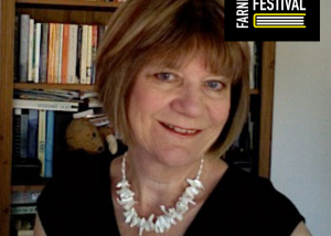 Image of author with books in background