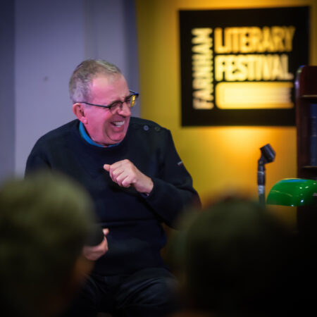 Author laughing on stage